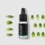 Black glass bottle with dropper containing organic peppermint essential oil surrounded by fresh green mint leaves on white background