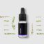 Black glass bottle with pipette containing BIO thyme essential oil surrounded by fresh green herb twigs on light background